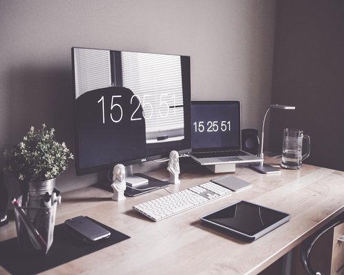 Ergonomic desk setup with a laptop positioned at eye level